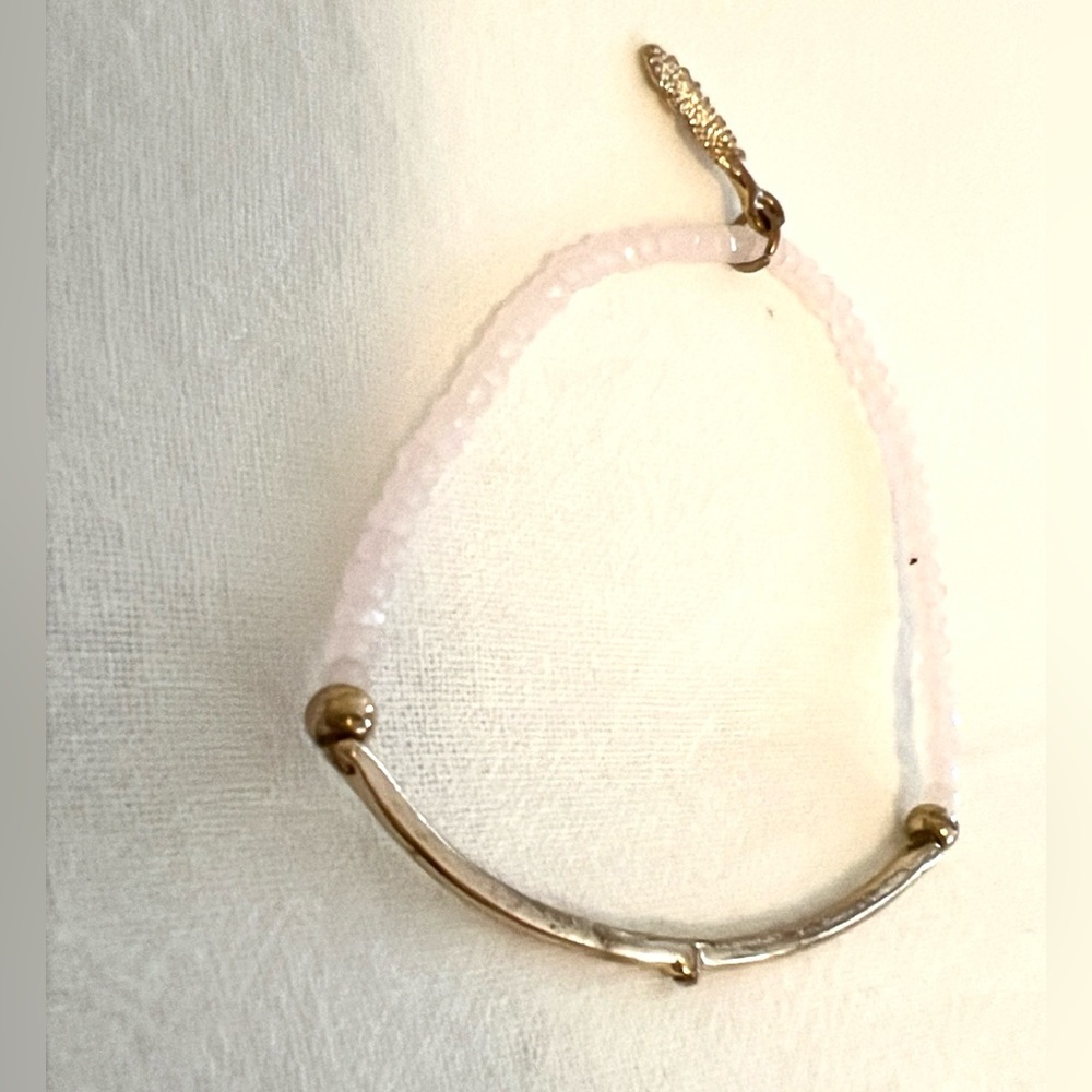 Rose quartz stacking bracelet with feather charm and gold bar